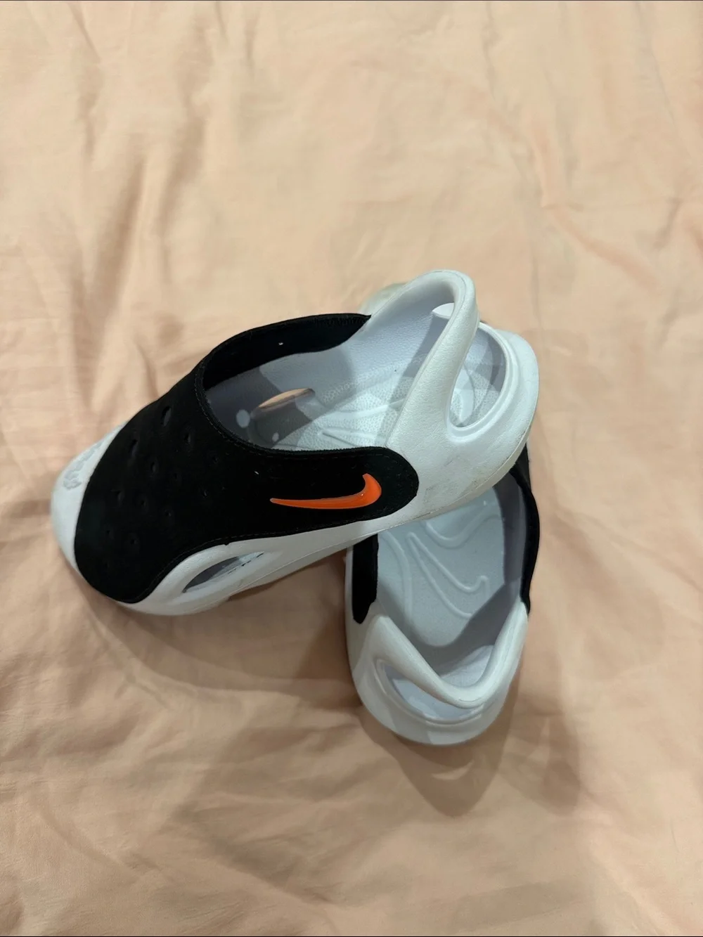 Nike Black and White Slip-On Clogs with Orange Accent